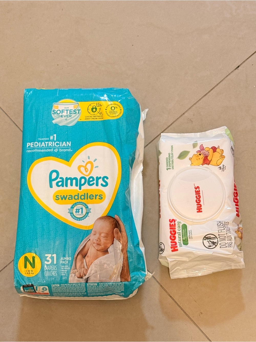 Pampers Swaddlers diapers size N (31 count) and Huggies wipes